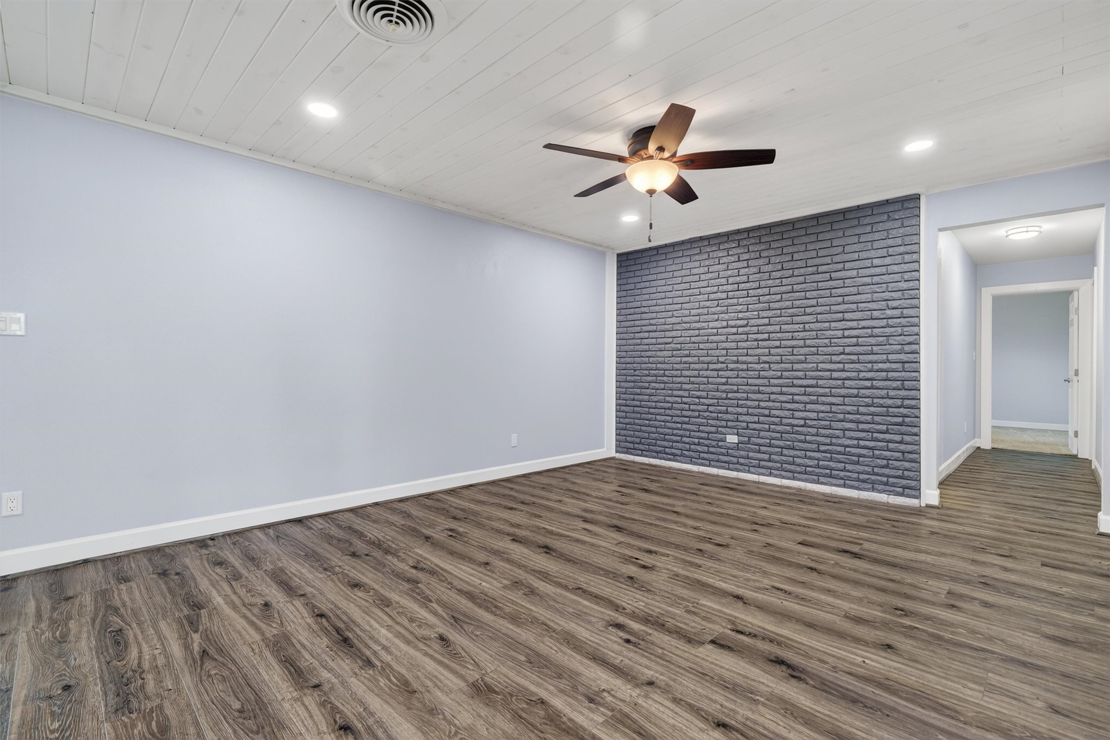379 Hale Road Bay City, TX 77414 - Photo 10 of 28 wooden floor in an empty room with a window