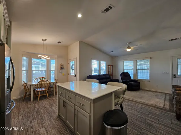 a living room with furniture a couch and a chandelier