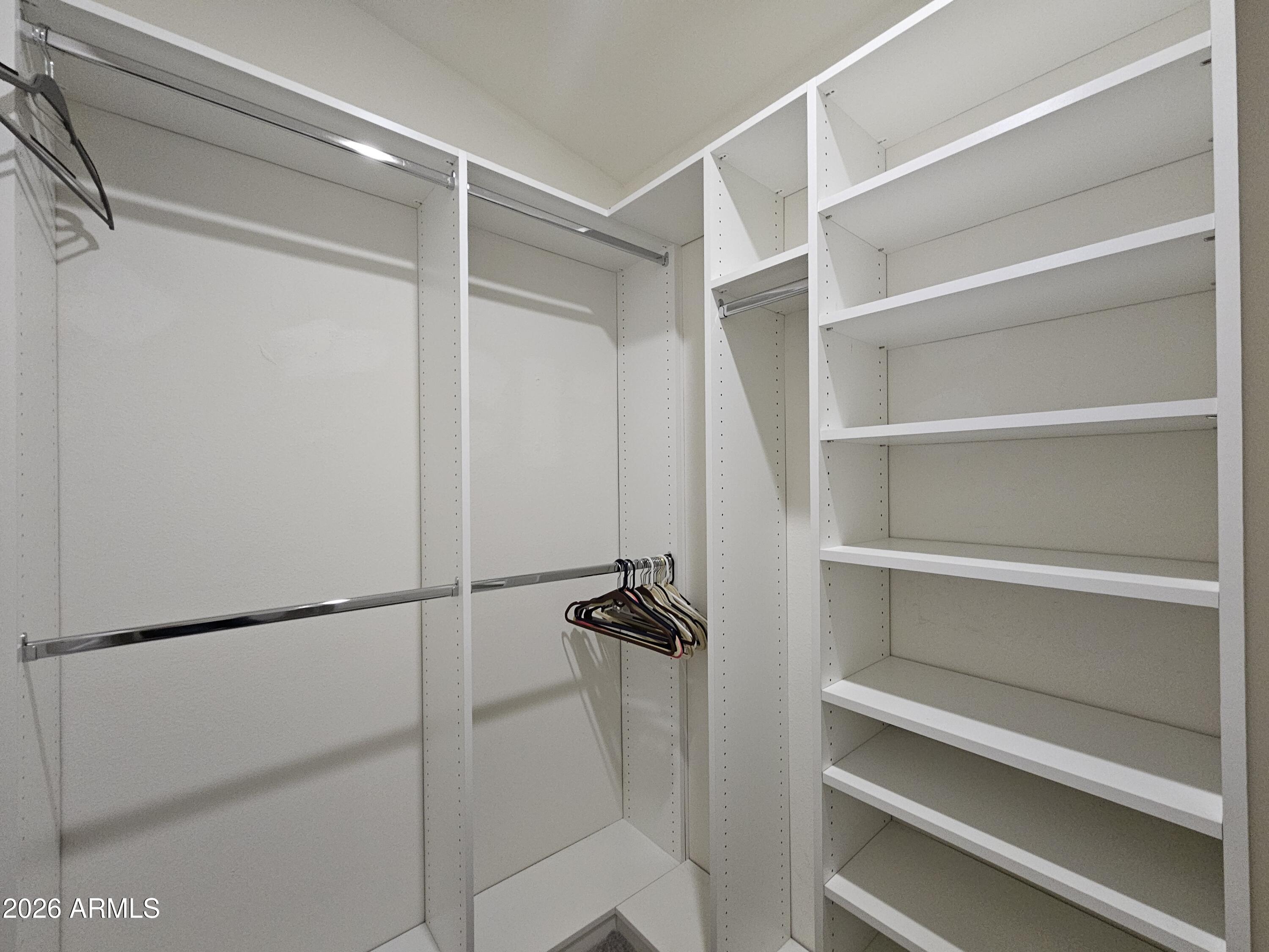 650 North Hawes Road, Unit 3223 Mesa, AZ 85207 - Photo 24 of 39 a view of walk in closet with empty racks