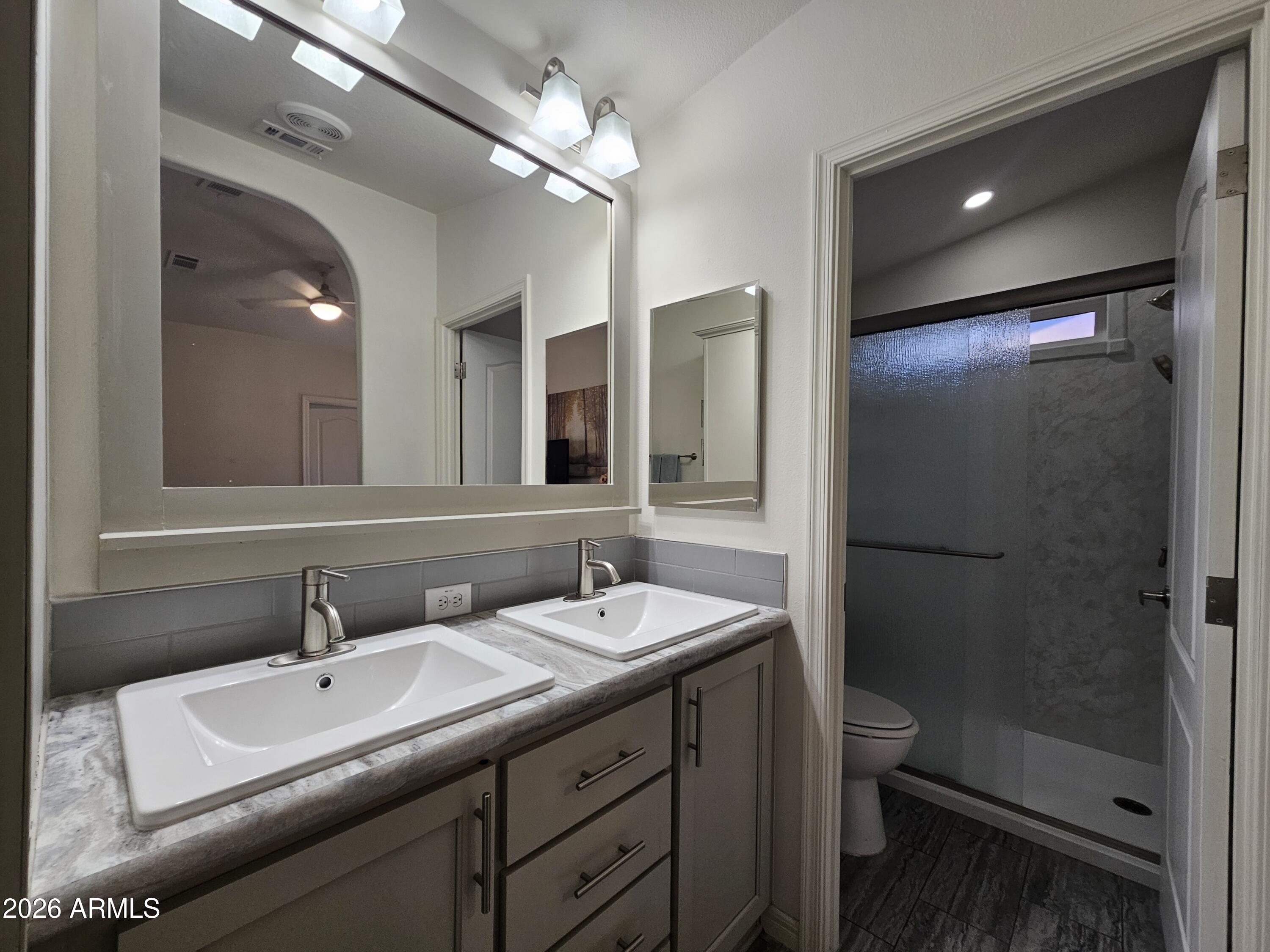 650 North Hawes Road, Unit 3223 Mesa, AZ 85207 - Photo 25 of 39 a bathroom with a sink and a mirror