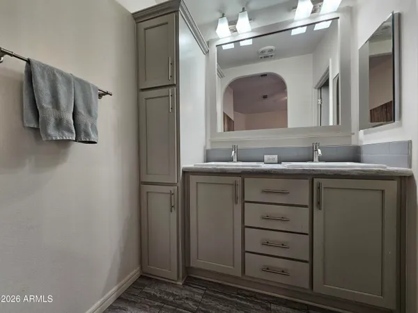 a view of a house with backyard patio and swimming pool