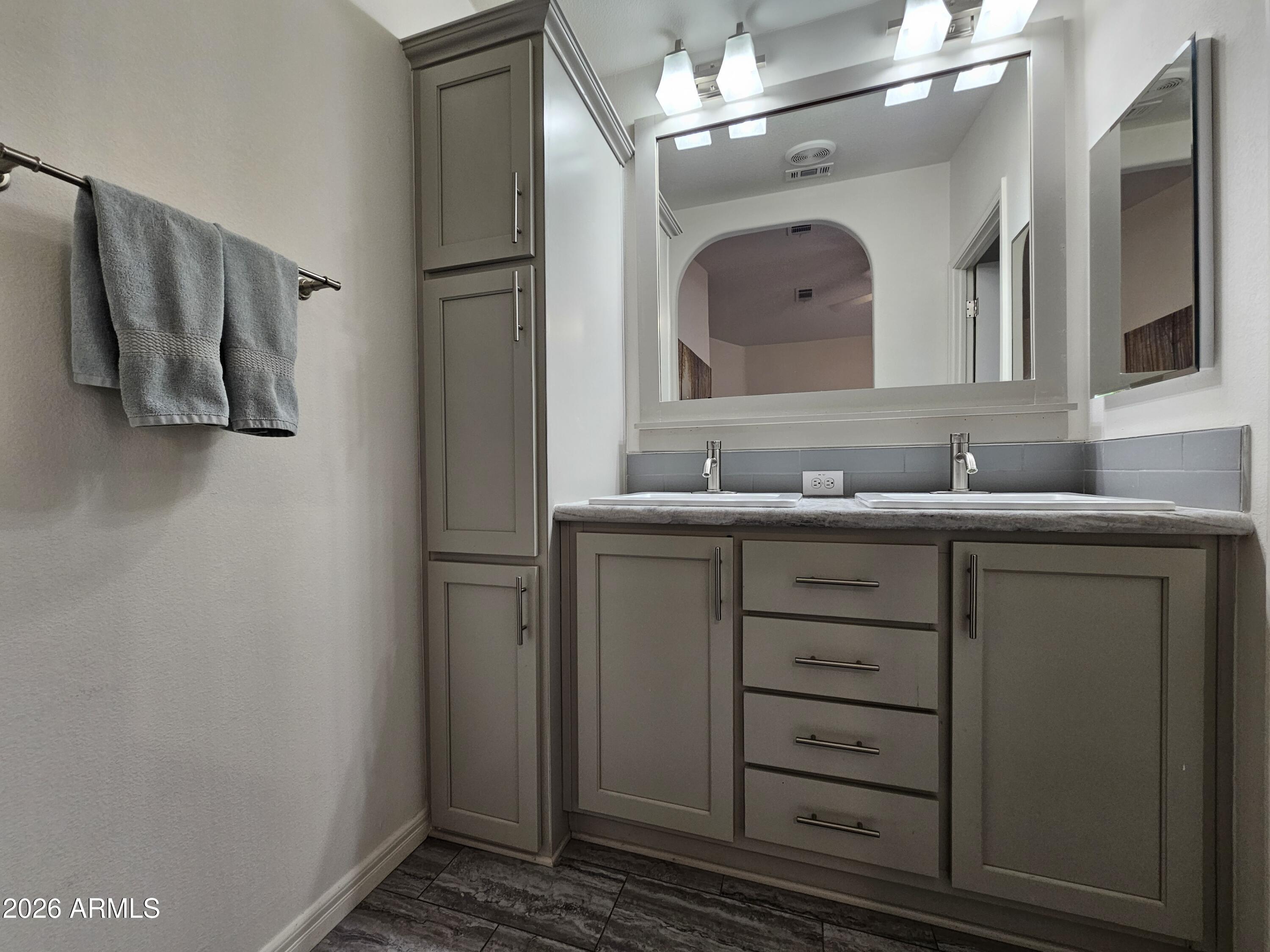 650 North Hawes Road, Unit 3223 Mesa, AZ 85207 - Photo 26 of 39 a bathroom with a sink vanity and a mirror