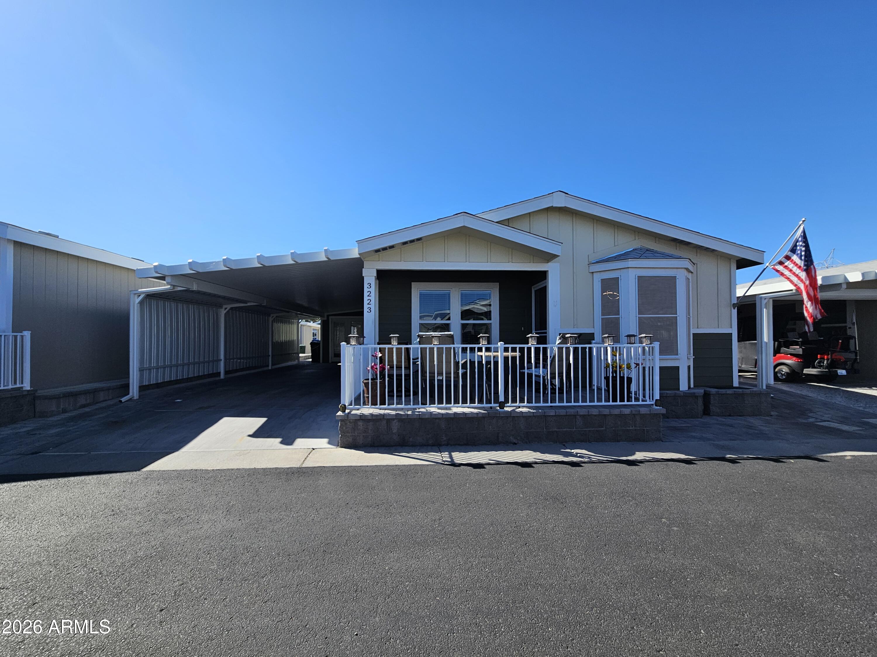 650 North Hawes Road, Unit 3223 Mesa, AZ 85207 - Photo 6 of 39 a front view of a house with a garden