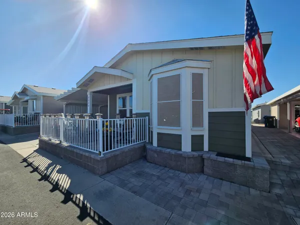 a view of a livingroom with porch and wooden floor