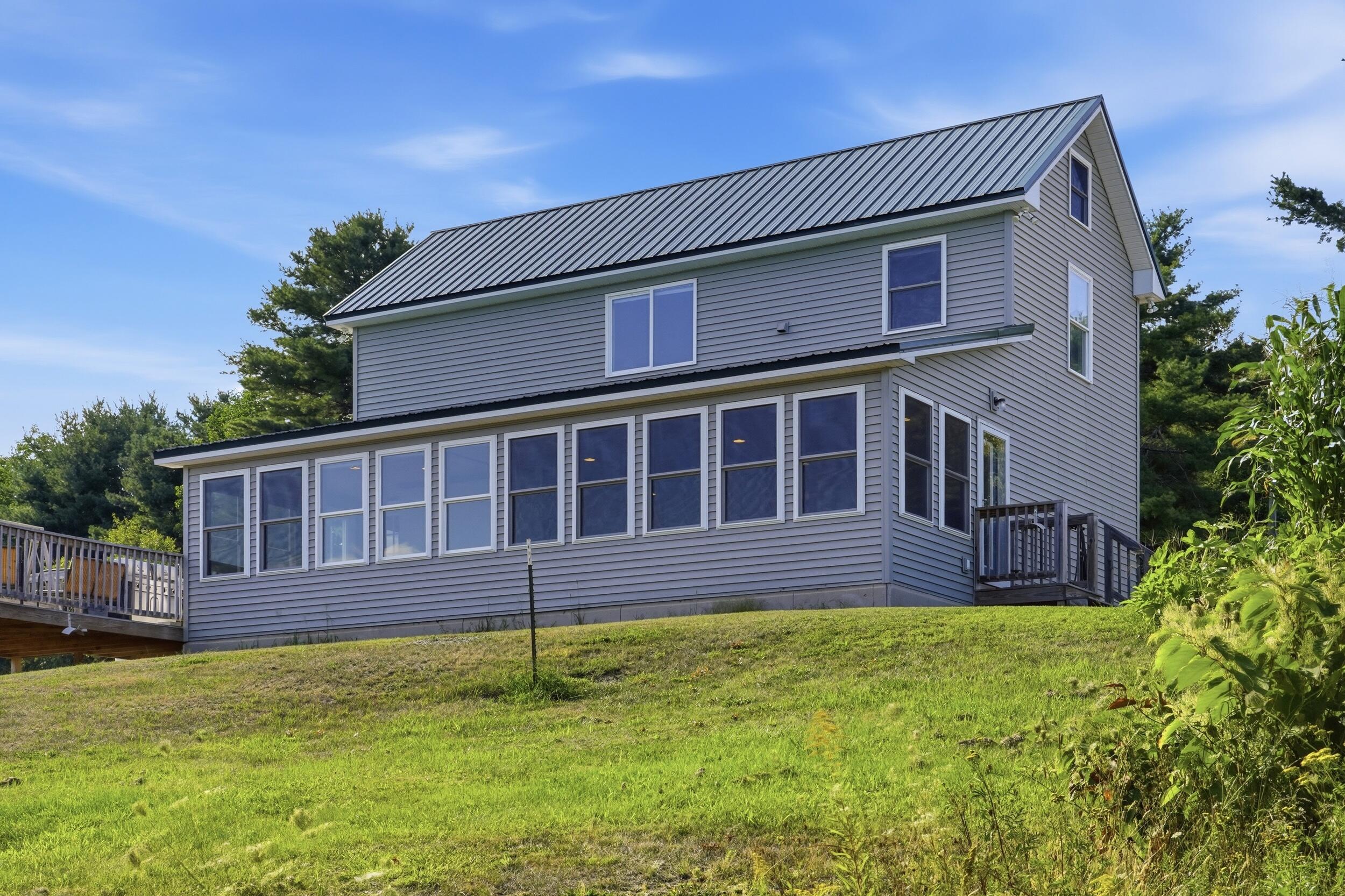 395 Lee Road Lincoln, ME 04457 - Photo 10 of 61 010_395lee_rear_sunroom_exterior