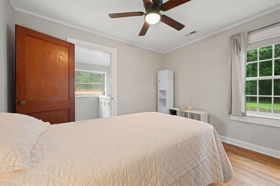 174 Holliday Road Six Mile, SC 29682 - Photo 24 of 49 Hardwood floors and generous natural light define this cozy and comfortable 2nd bedroom