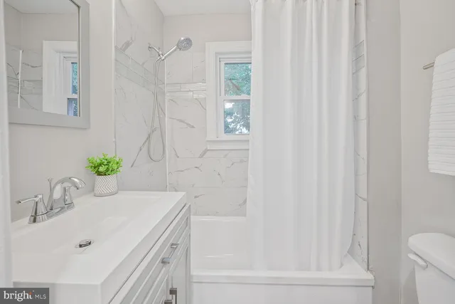 a bathroom with a sink and a bathtub