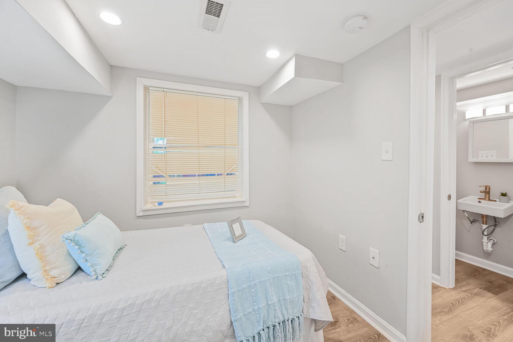 1459 Morris Road Southeast Washington, DC 20020 - Photo 18 of 25 a bedroom with a bed and a window