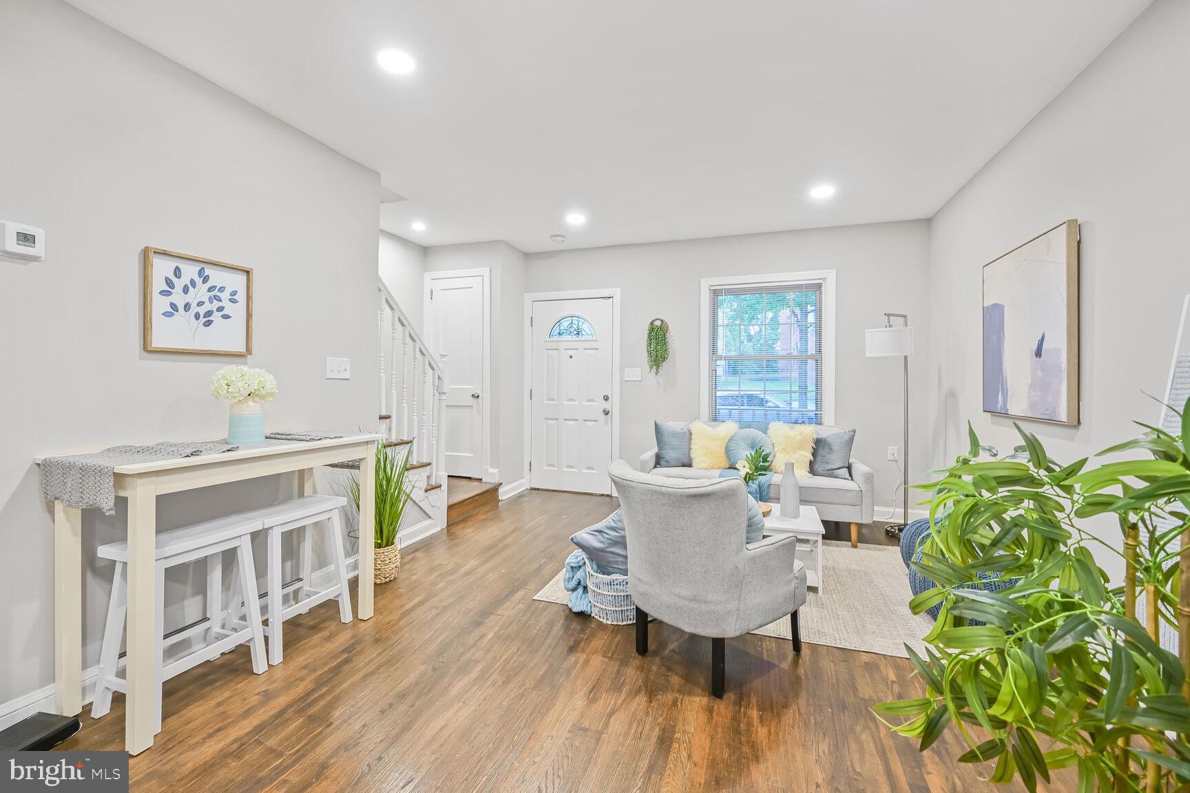 1459 Morris Road Southeast Washington, DC 20020 - Photo 2 of 25 a living room with furniture and a wooden floor