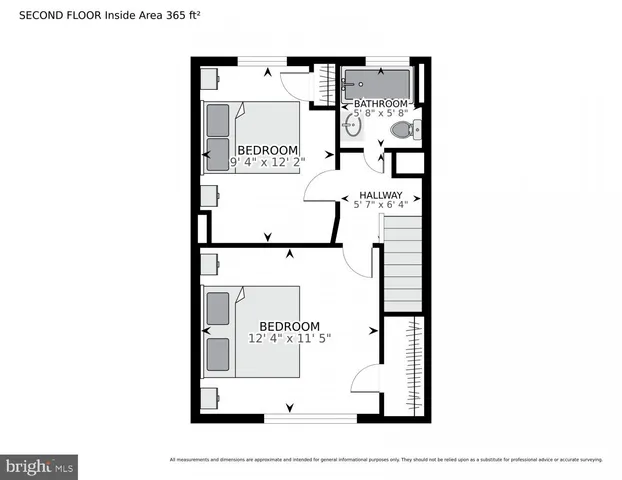 front view of a house with a tree