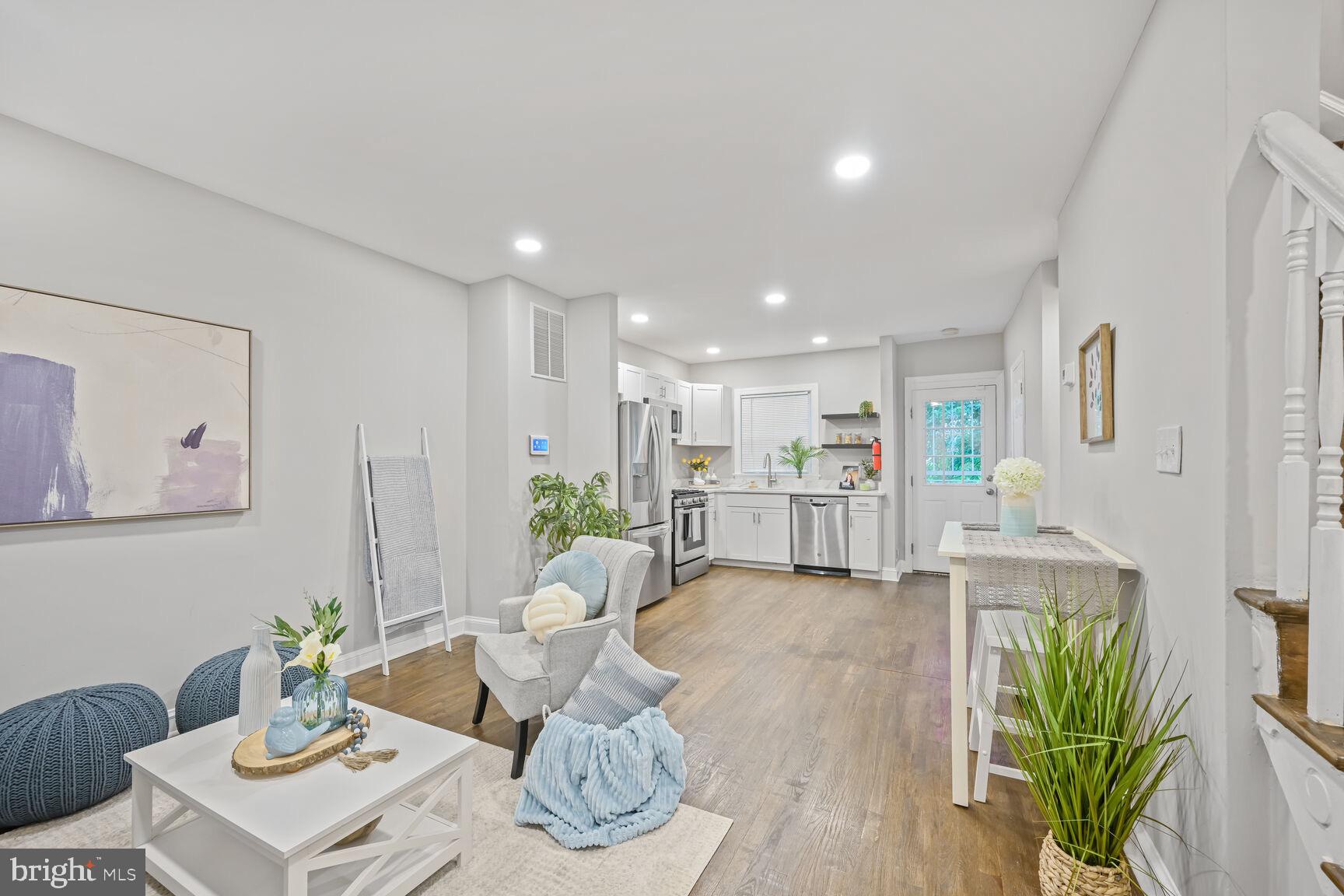 1459 Morris Road Southeast Washington, DC 20020 - Photo 4 of 25 a living room with furniture kitchen and a table