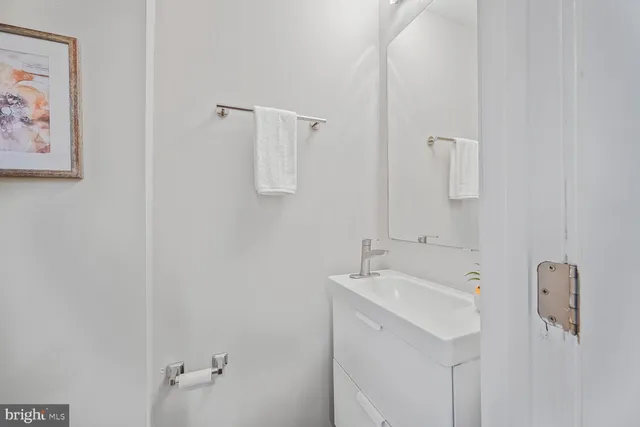 a bathroom with a sink and mirror