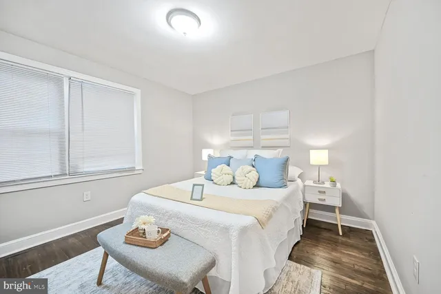 a bedroom with a bed and window