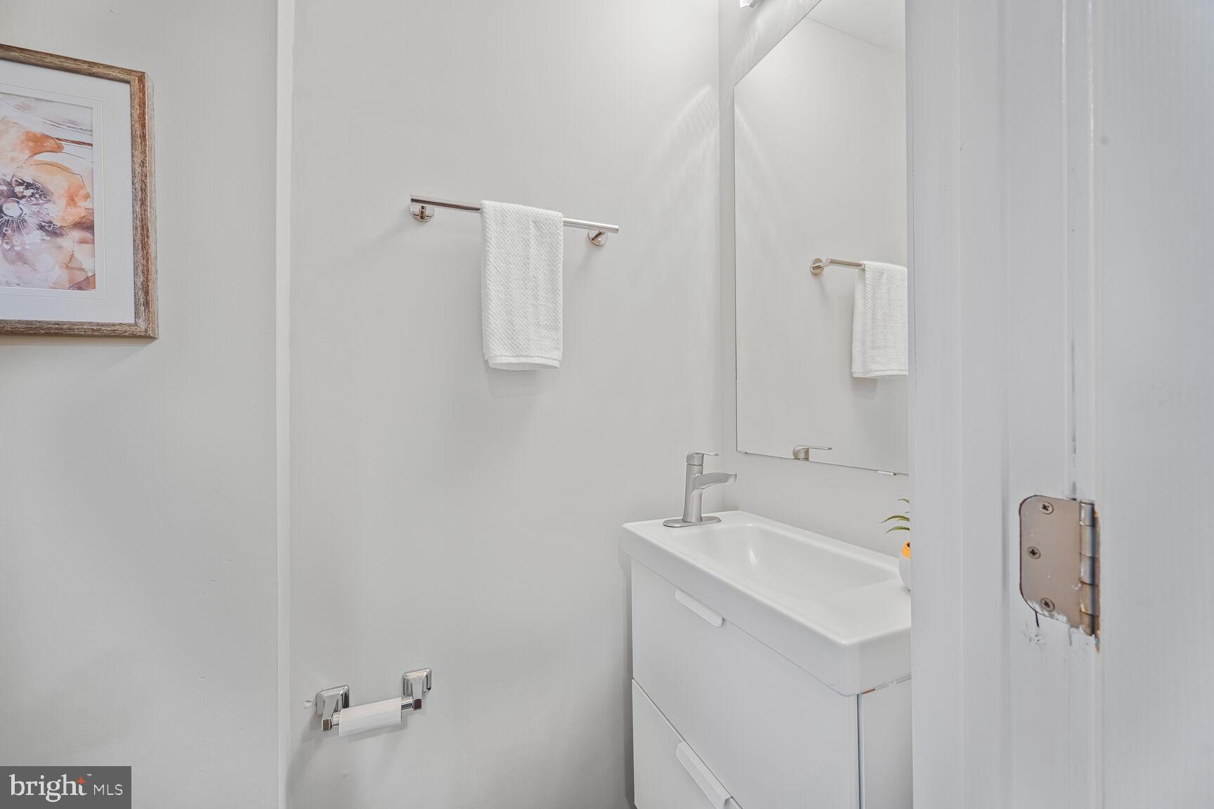 1459 Morris Road Southeast Washington, DC 20020 - Photo 7 of 25 a bathroom with a sink and mirror