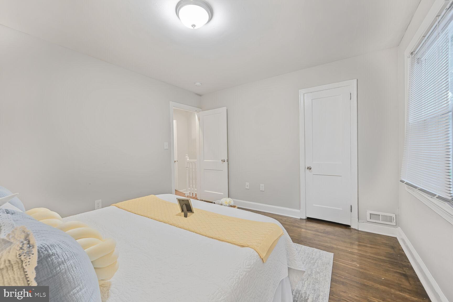 1459 Morris Road Southeast Washington, DC 20020 - Photo 10 of 25 a spacious bedroom with a bed and a table