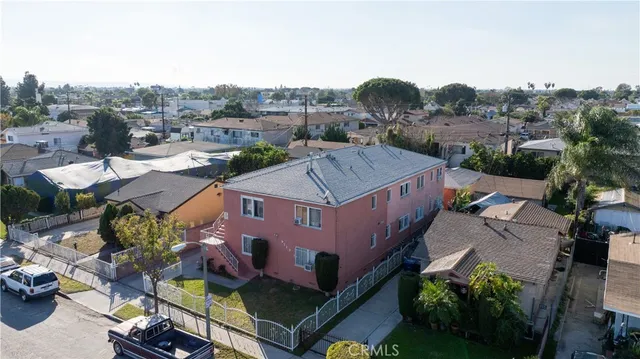 an aerial view of houses with outdoor space
