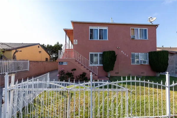 a front view of house and swimming pool