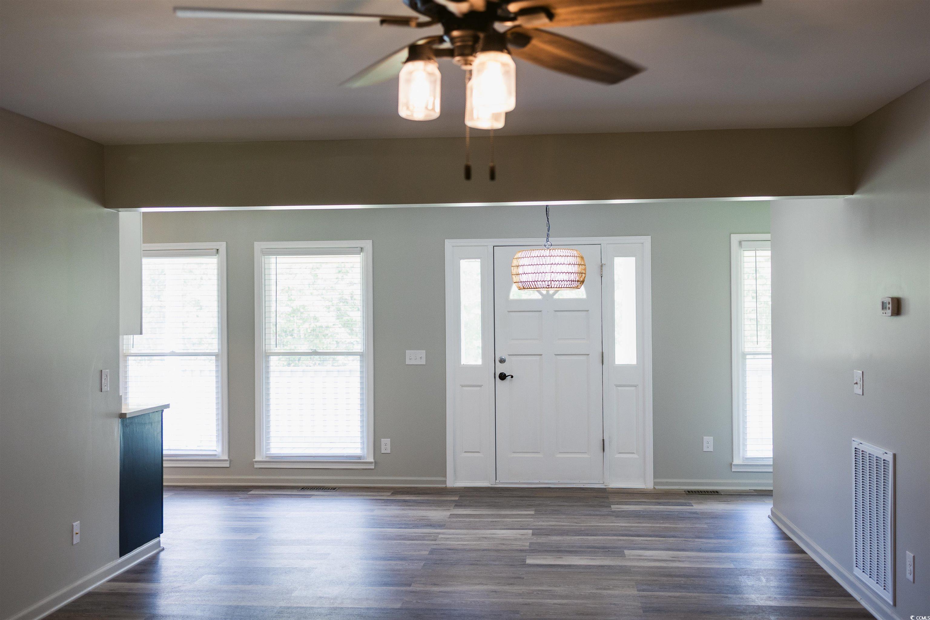 2851 Highway 984 Galivants Ferry, SC 29544 - Photo 14 of 23 Foyer entrance with dark wood-style flooring and a ceiling fan