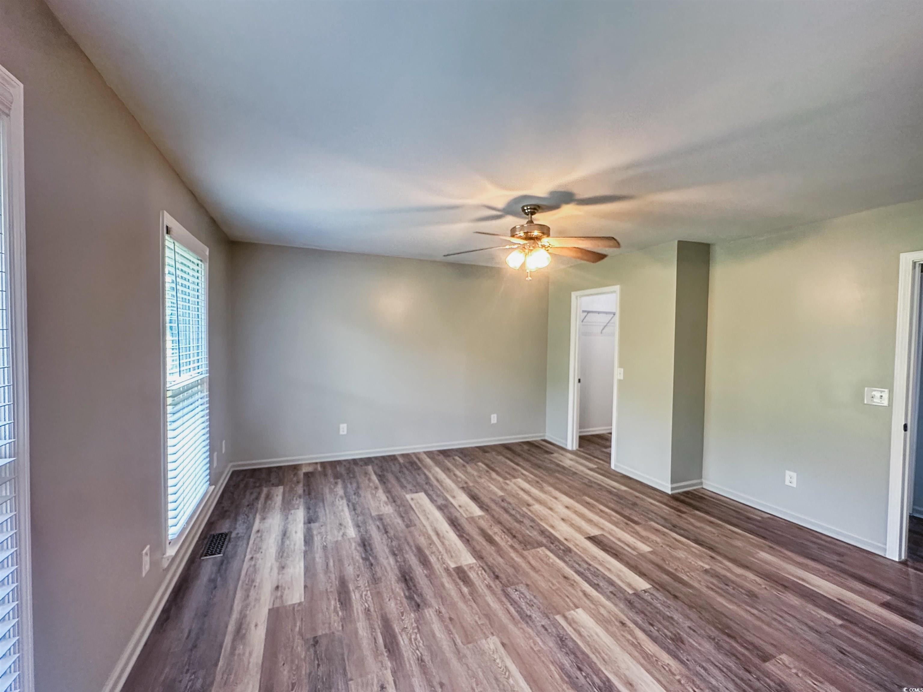 2851 Highway 984 Galivants Ferry, SC 29544 - Photo 8 of 23 Unfurnished room with wood finished floors and a ceiling fan
