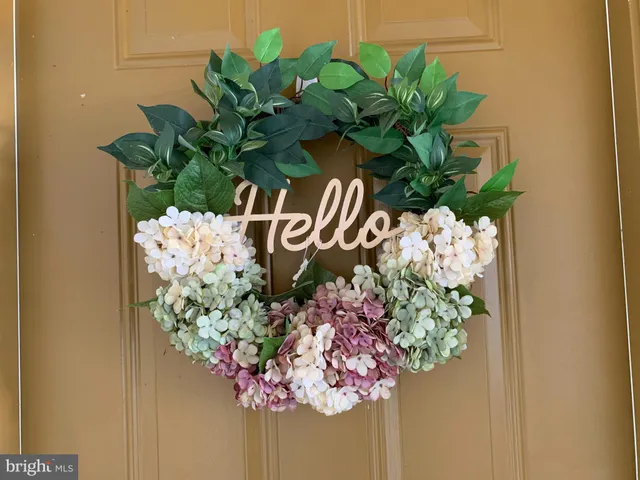 a plant with a white vase with white and white flowers