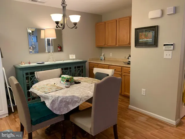 a view of hallway with wooden floor