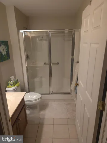 a bedroom with a bed and a closet