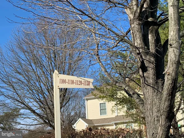 a kitchen with a sink a stove and cabinets