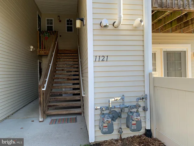 a kitchen with sink cabinets and wooden floor