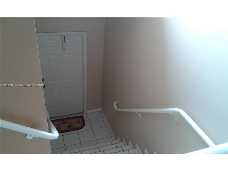9702 Southwest 138th Avenue, Unit 9702 Miami, FL 33186 - Photo 11 of 15 a bathroom with a sink