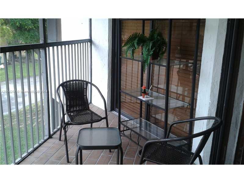 9702 Southwest 138th Avenue, Unit 9702 Miami, FL 33186 - Photo 15 of 15 a view of a living room and dining room