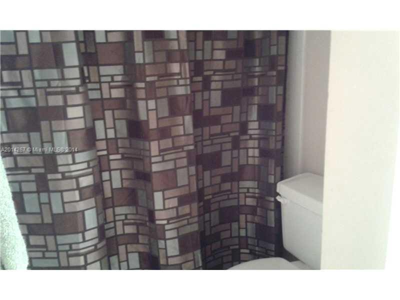 9702 Southwest 138th Avenue, Unit 9702 Miami, FL 33186 - Photo 7 of 15 a bathroom with a shower