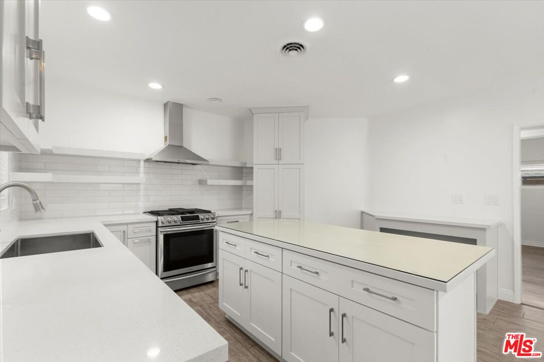 262 MacDonald Street Pasadena, CA 91103 - Photo 1 of 26 a kitchen with white cabinets and appliances