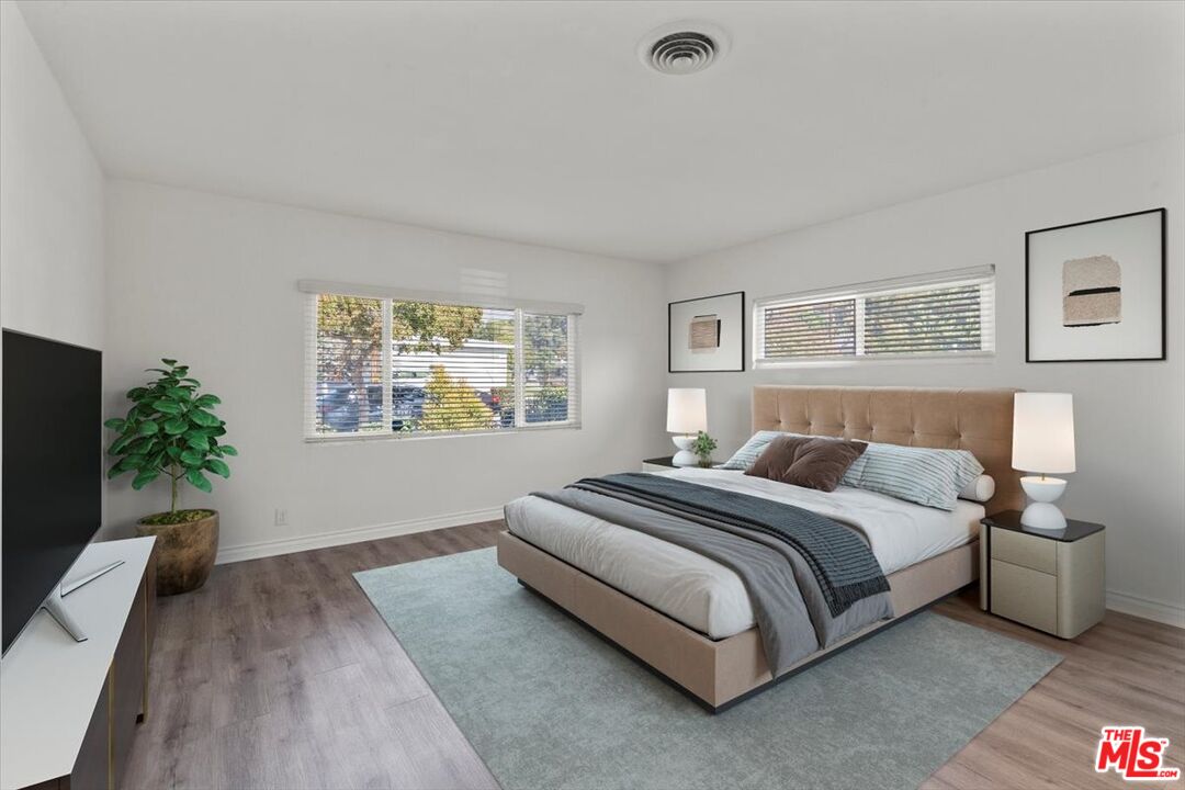 262 MacDonald Street Pasadena, CA 91103 - Photo 13 of 26 a spacious bedroom with a bed and a couch