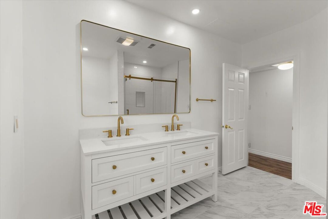 262 MacDonald Street Pasadena, CA 91103 - Photo 16 of 26 a bathroom with a double vanity sink mirror and double