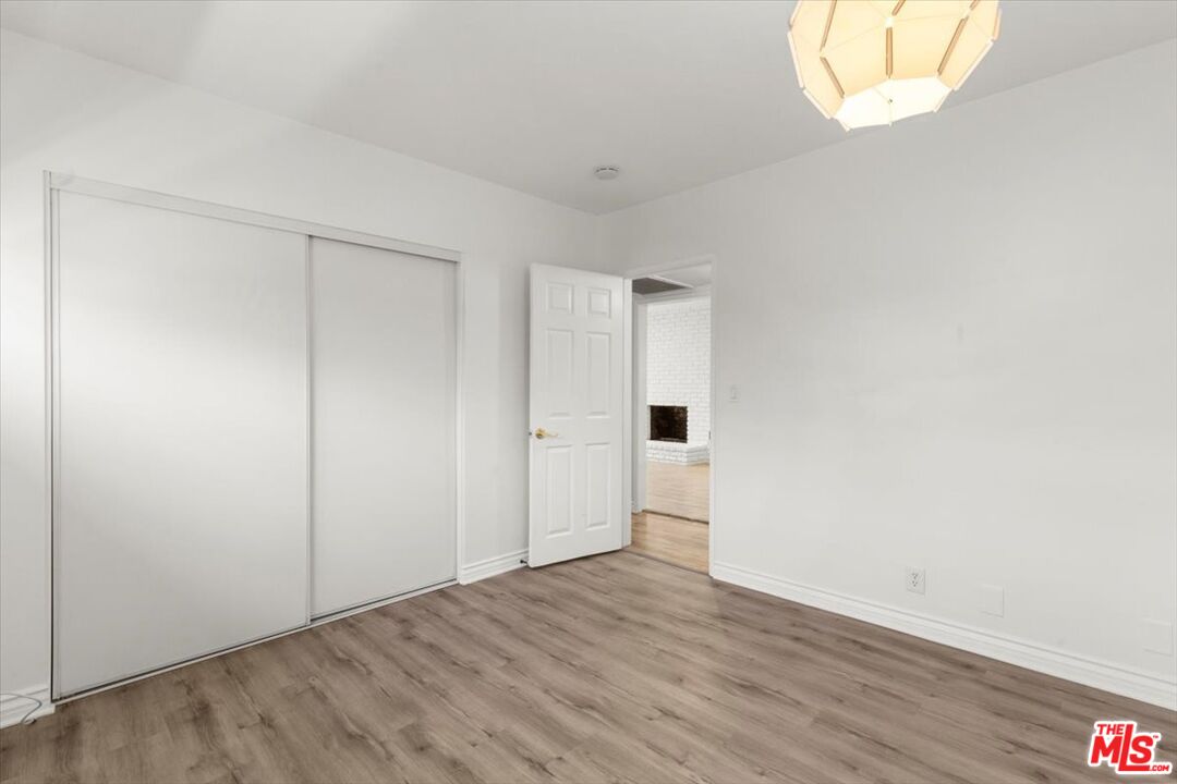 262 MacDonald Street Pasadena, CA 91103 - Photo 20 of 26 an empty room with wooden floor and windows