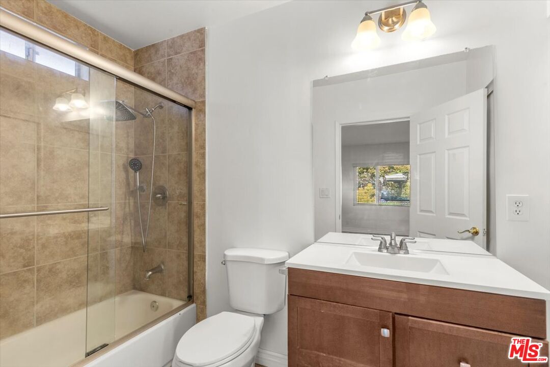 262 MacDonald Street Pasadena, CA 91103 - Photo 22 of 26 a bathroom with a sink toilet and shower