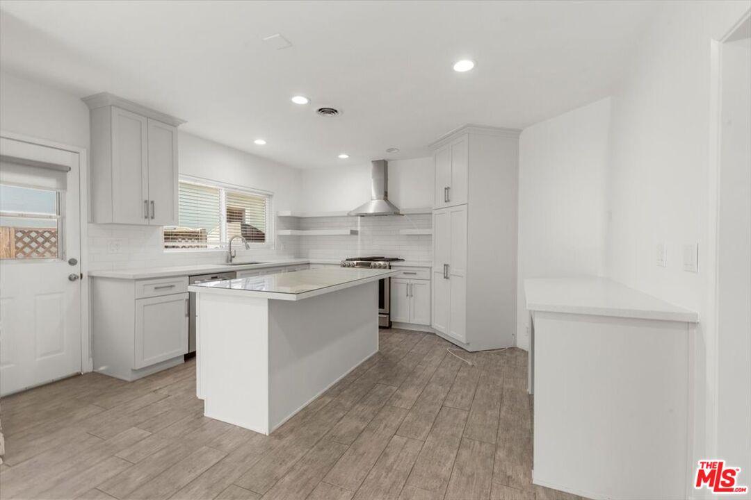 262 MacDonald Street Pasadena, CA 91103 - Photo 4 of 26 a kitchen with a sink window and cabinets