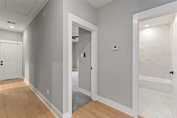 a view of a bathroom from a hallway