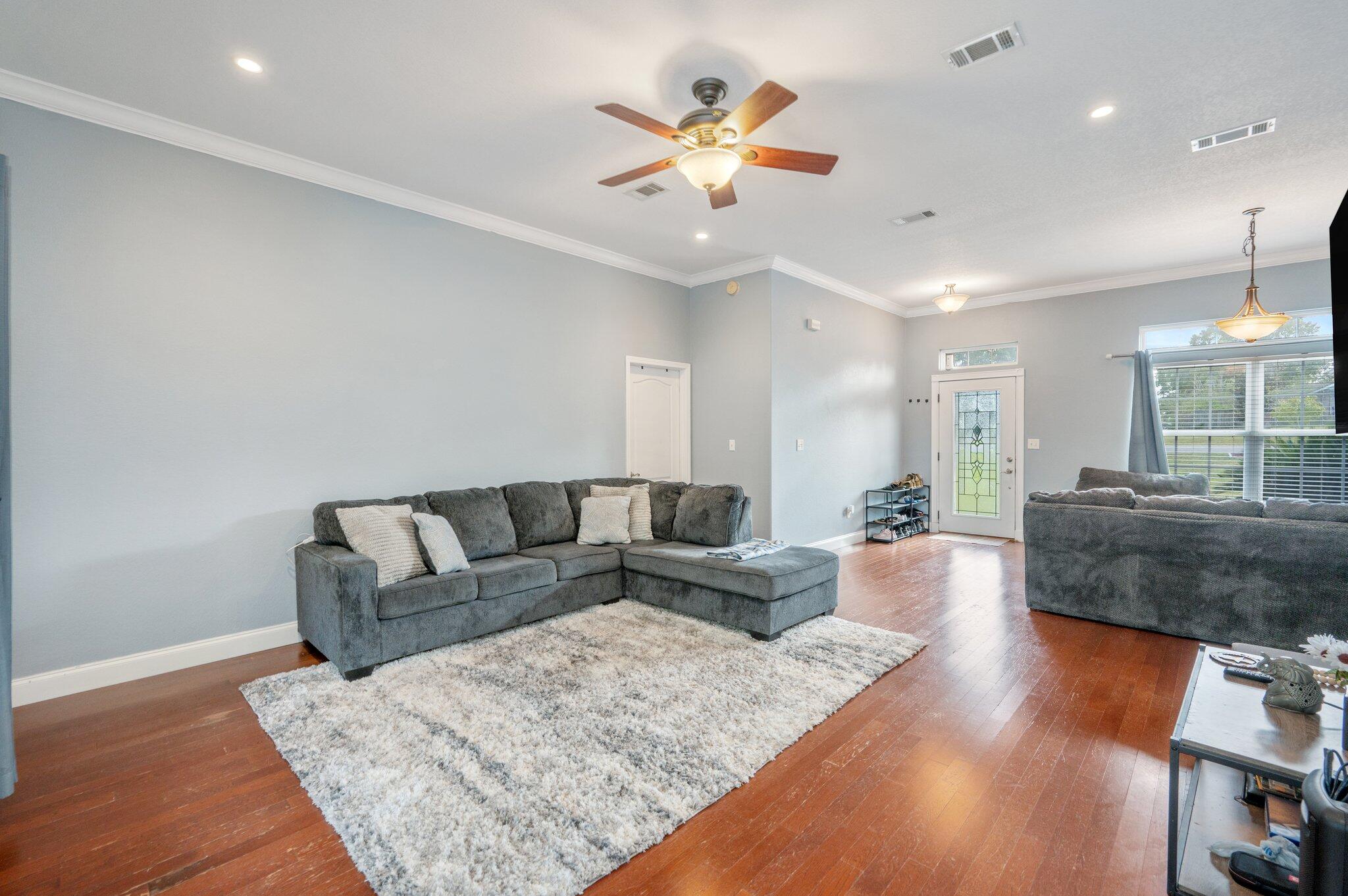 730 Riva Ridge Drive Crestview, FL 32539 - Photo 5 of 29 a living room with furniture and a wooden floor