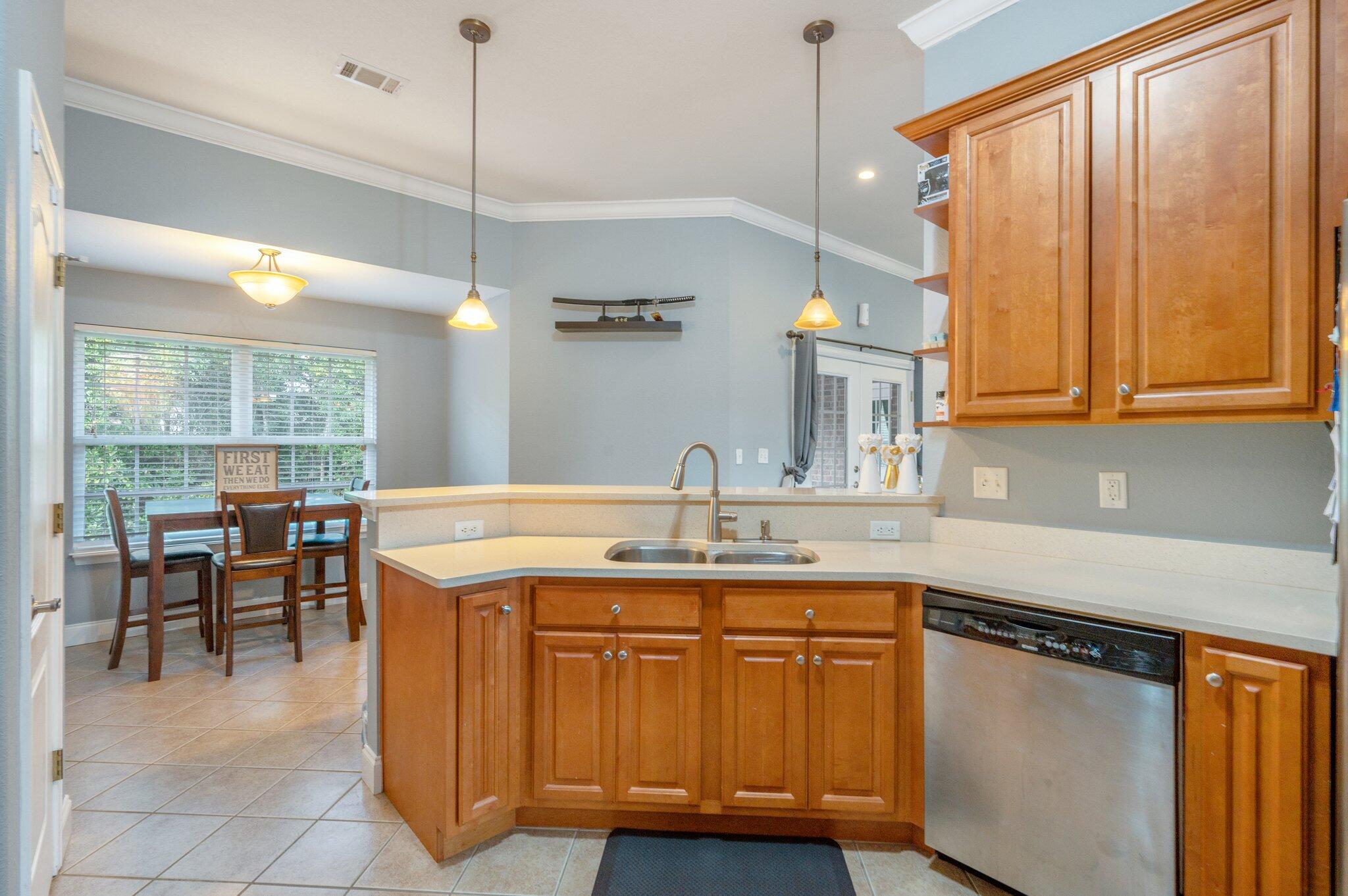 730 Riva Ridge Drive Crestview, FL 32539 - Photo 7 of 29 a kitchen with kitchen island granite countertop a sink a stove and cabinets