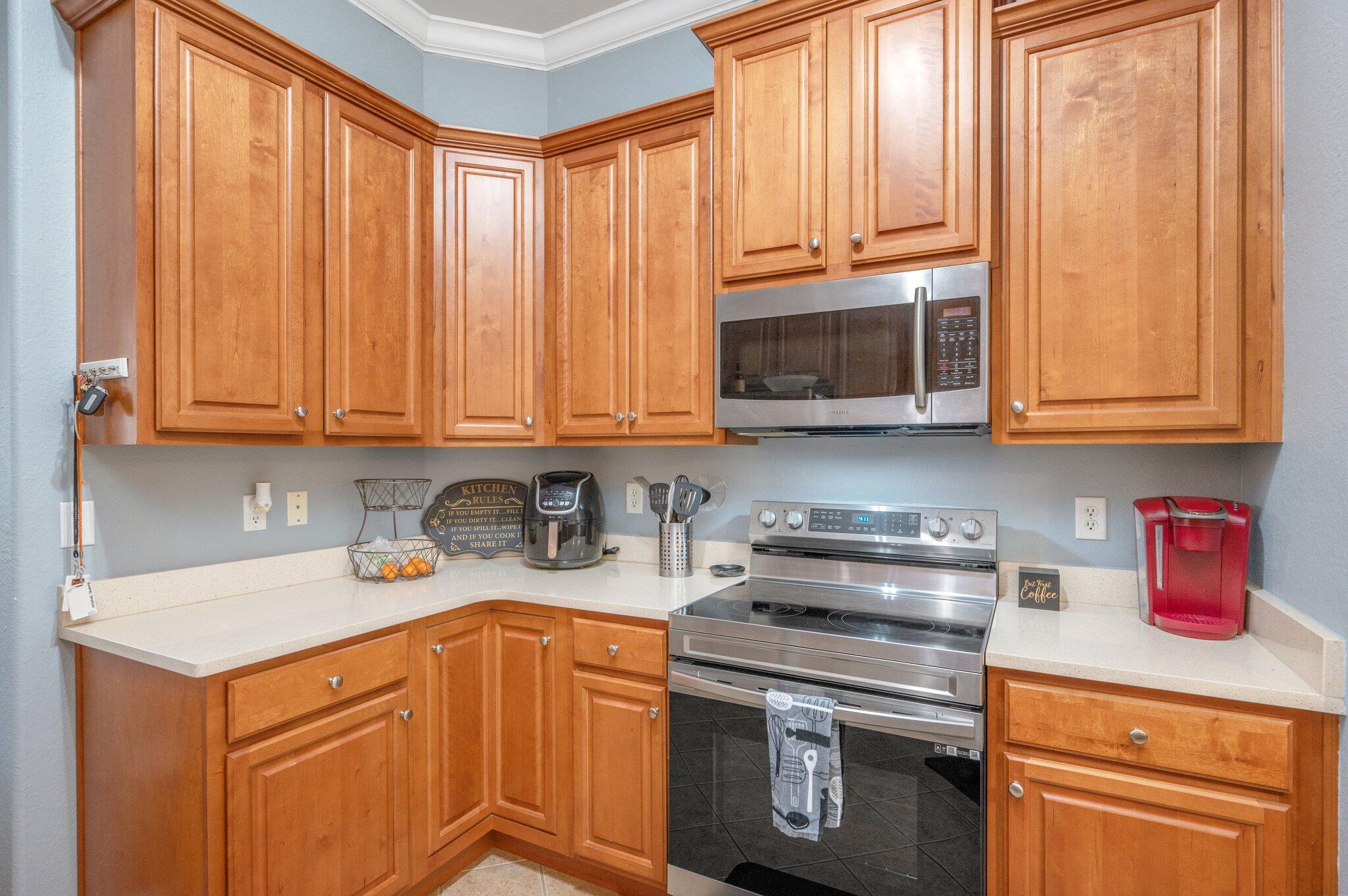 730 Riva Ridge Drive Crestview, FL 32539 - Photo 9 of 29 a kitchen with stainless steel appliances granite countertop a sink a stove and cabinets