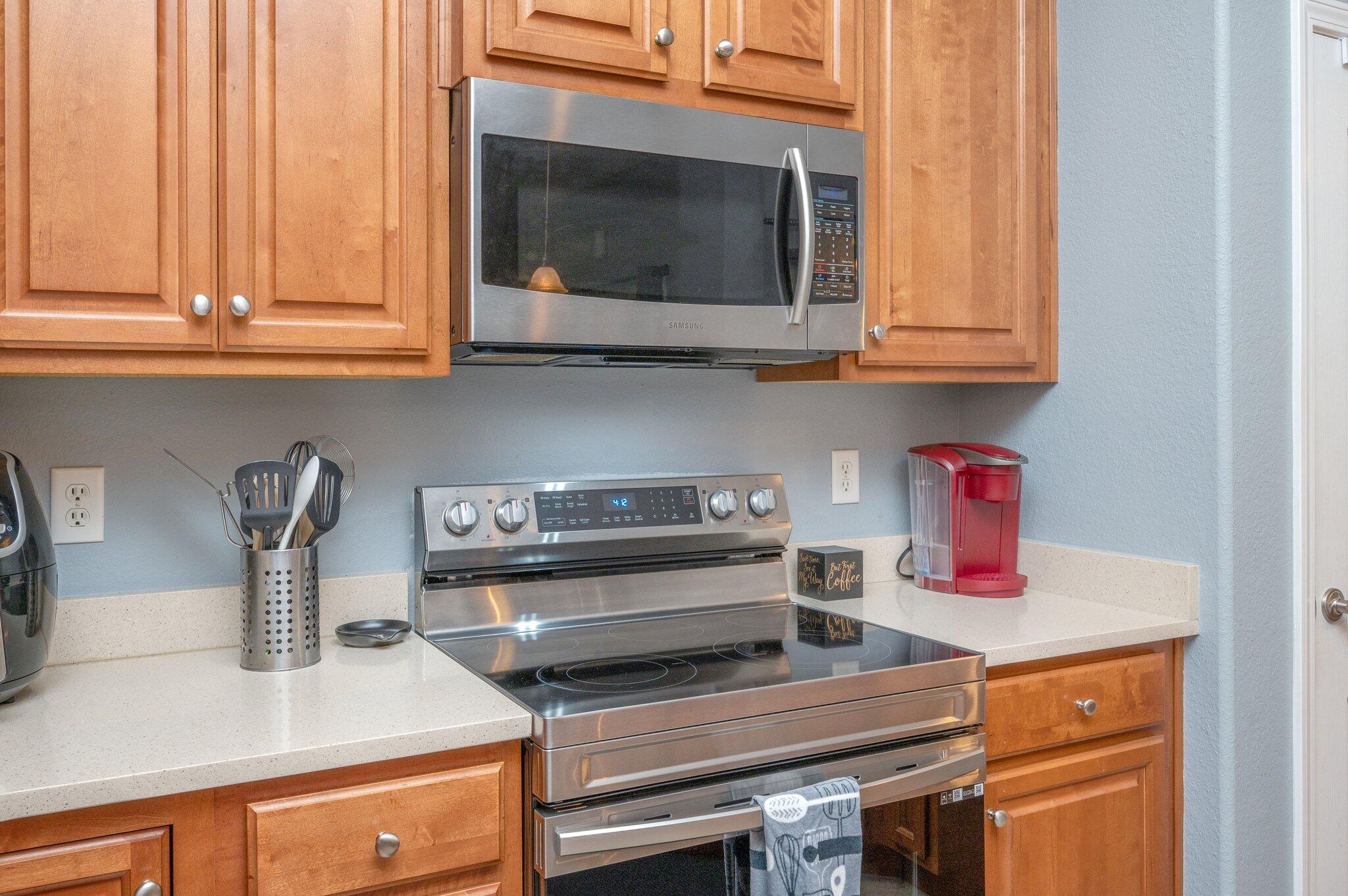 730 Riva Ridge Drive Crestview, FL 32539 - Photo 10 of 29 a kitchen with a stove and a microwave