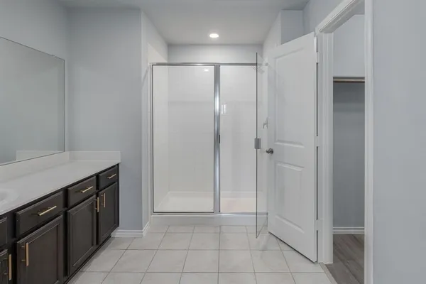 a kitchen with a sink and a refrigerator