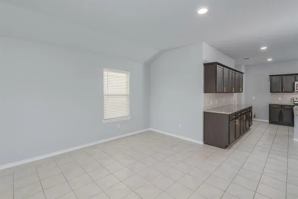 a view of kitchen with cabinets
