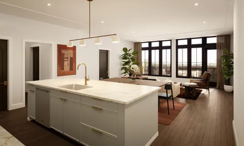 a kitchen with a sink a counter and chairs