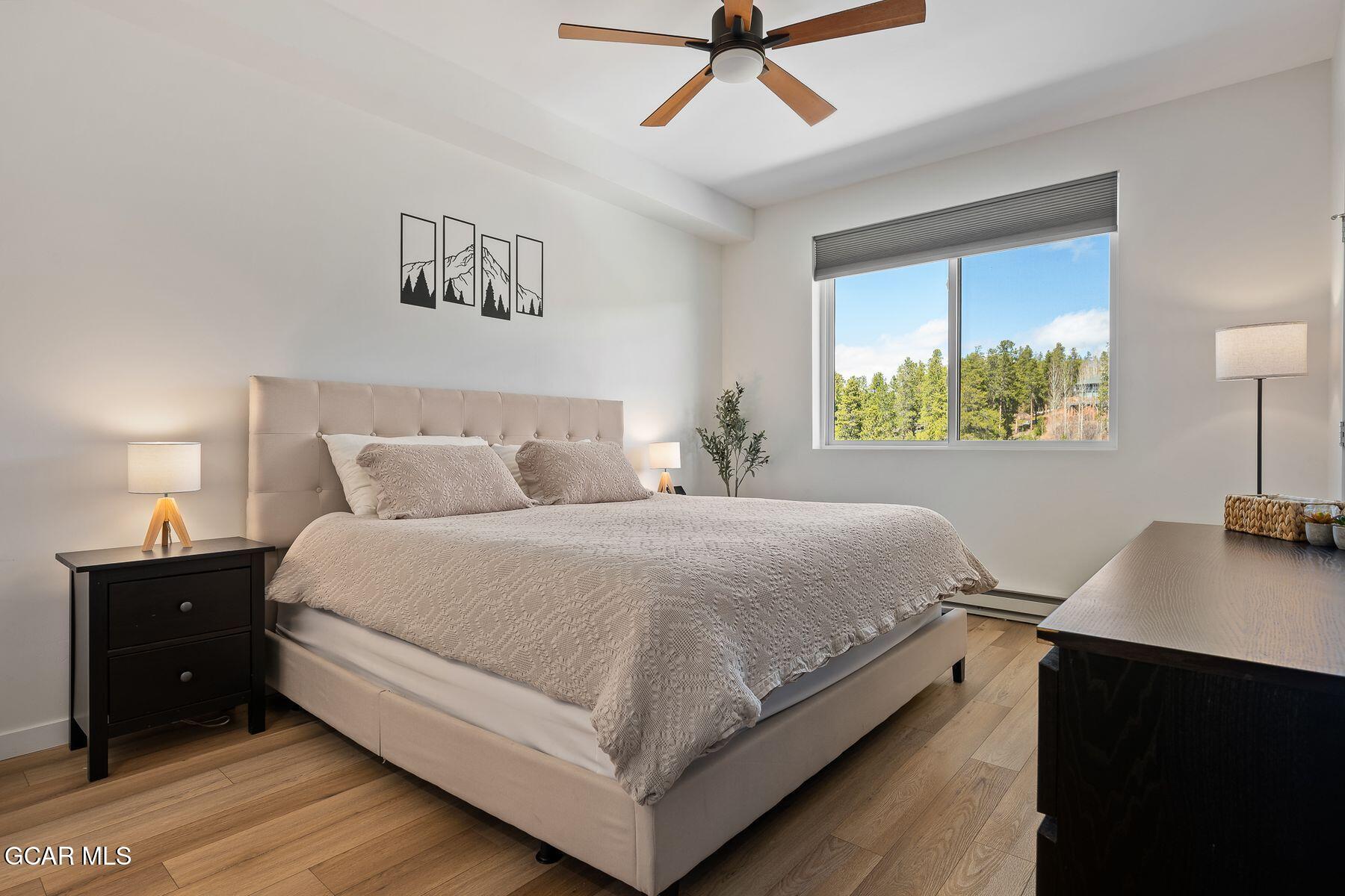421 West Meadow Mile, Unit 3 Fraser, CO 80442 - Photo 13 of 29 a bedroom with a bed and a desk