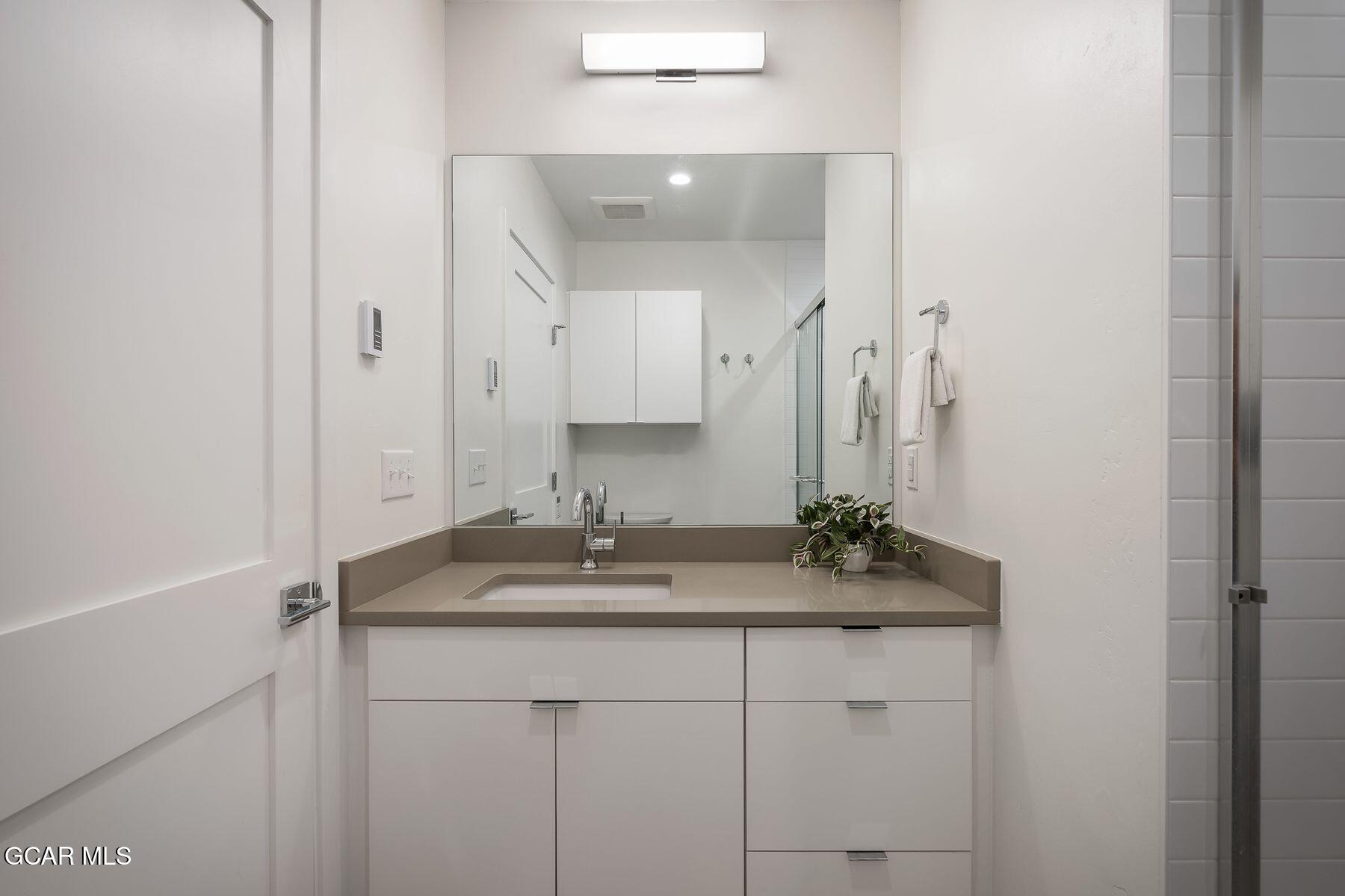 421 West Meadow Mile, Unit 3 Fraser, CO 80442 - Photo 17 of 29 a bathroom with a sink and a mirror