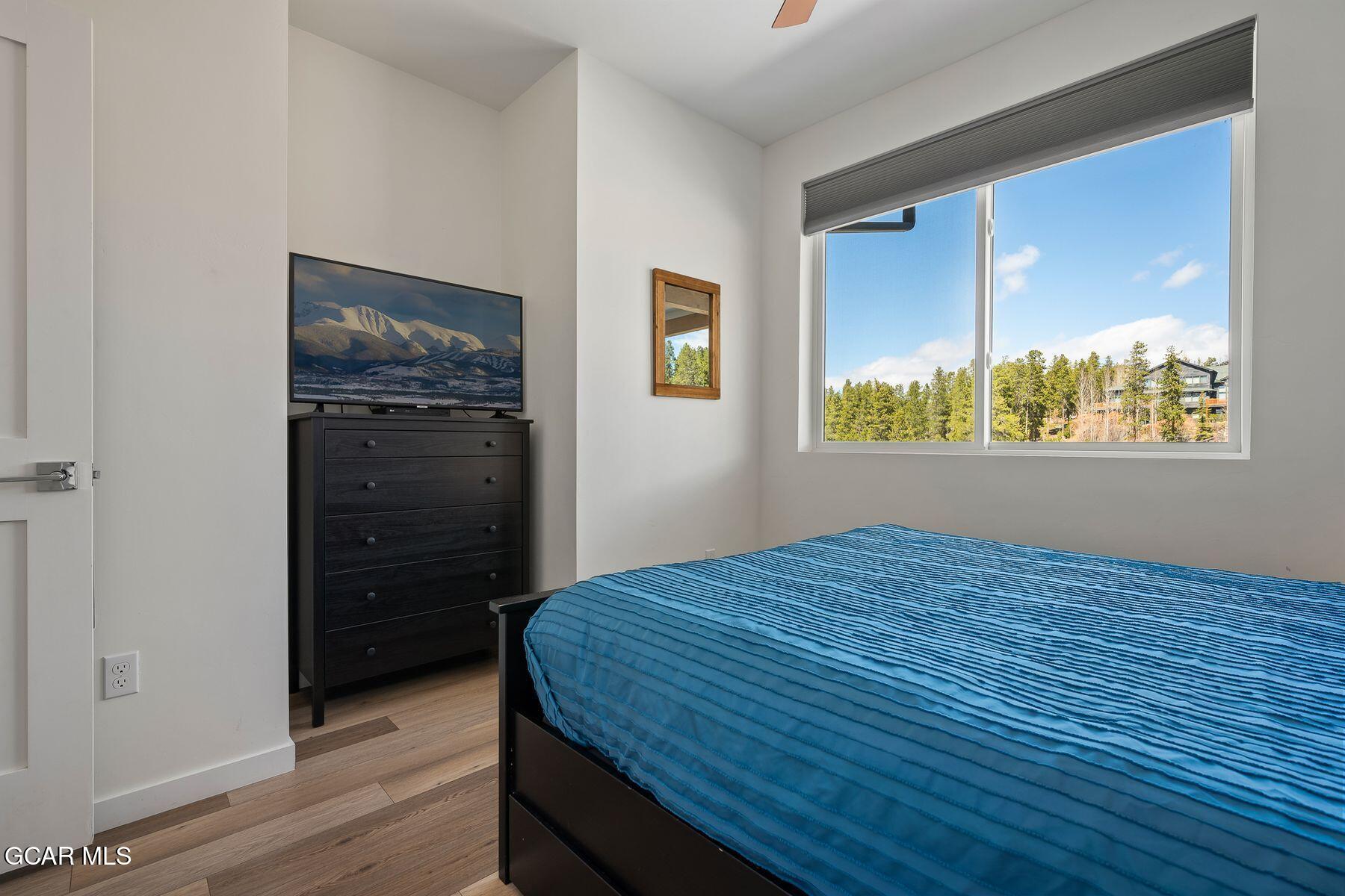 421 West Meadow Mile, Unit 3 Fraser, CO 80442 - Photo 20 of 29 a bedroom with a bed and a window
