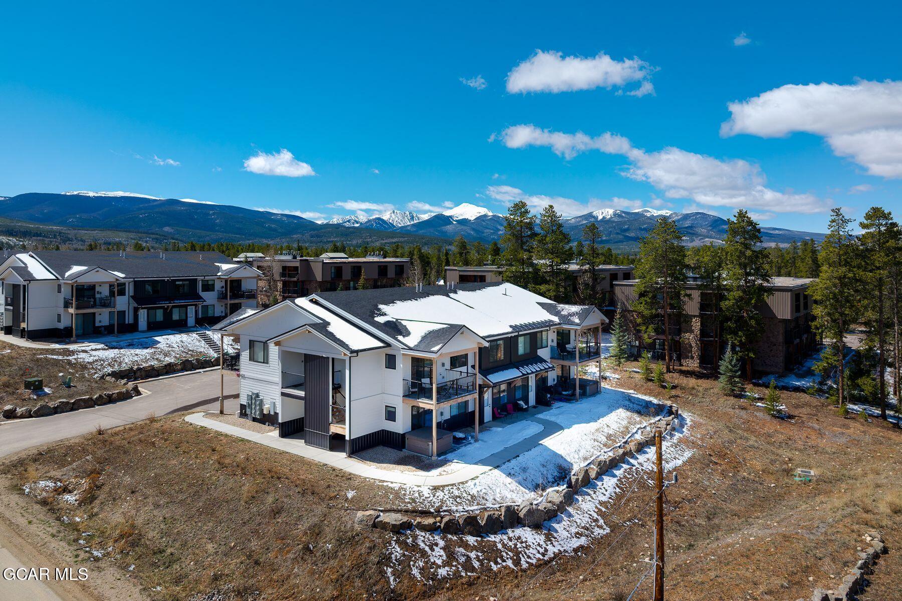 421 West Meadow Mile, Unit 3 Fraser, CO 80442 - Photo 28 of 29 a view of a house with a swimming pool and sitting area