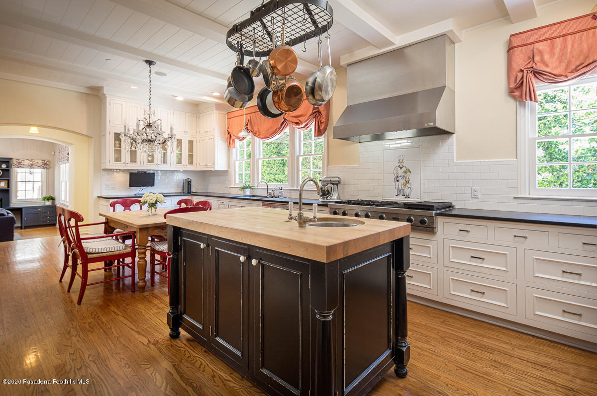 153 Sierra View Road Pasadena, CA 91105 - Photo 17 of 54 a kitchen with a sink cabinets and window